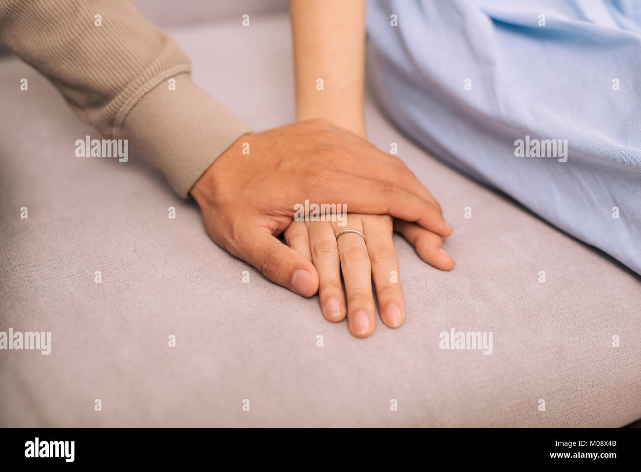 Couple in love. Man and woman holding hands together Stock Photo - Alamy
