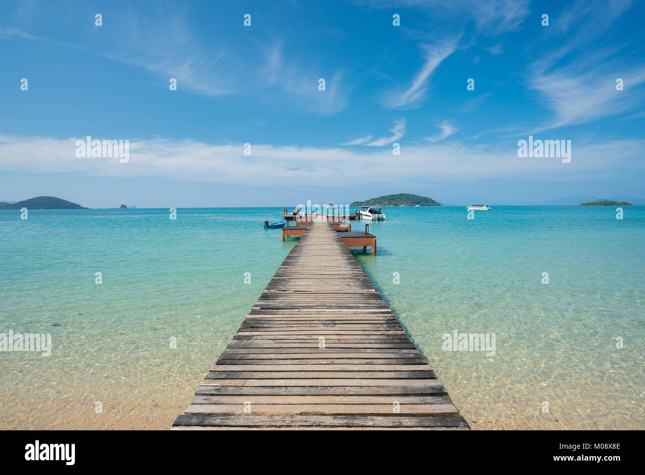 Wooden pier with boat in Phuket, Thailand. Summer, Travel, Vacation and Holiday concept. Stock Photo