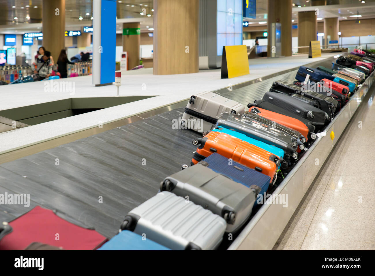 Suitcase or luggage with conveyor belt in the airport. Stock Photo