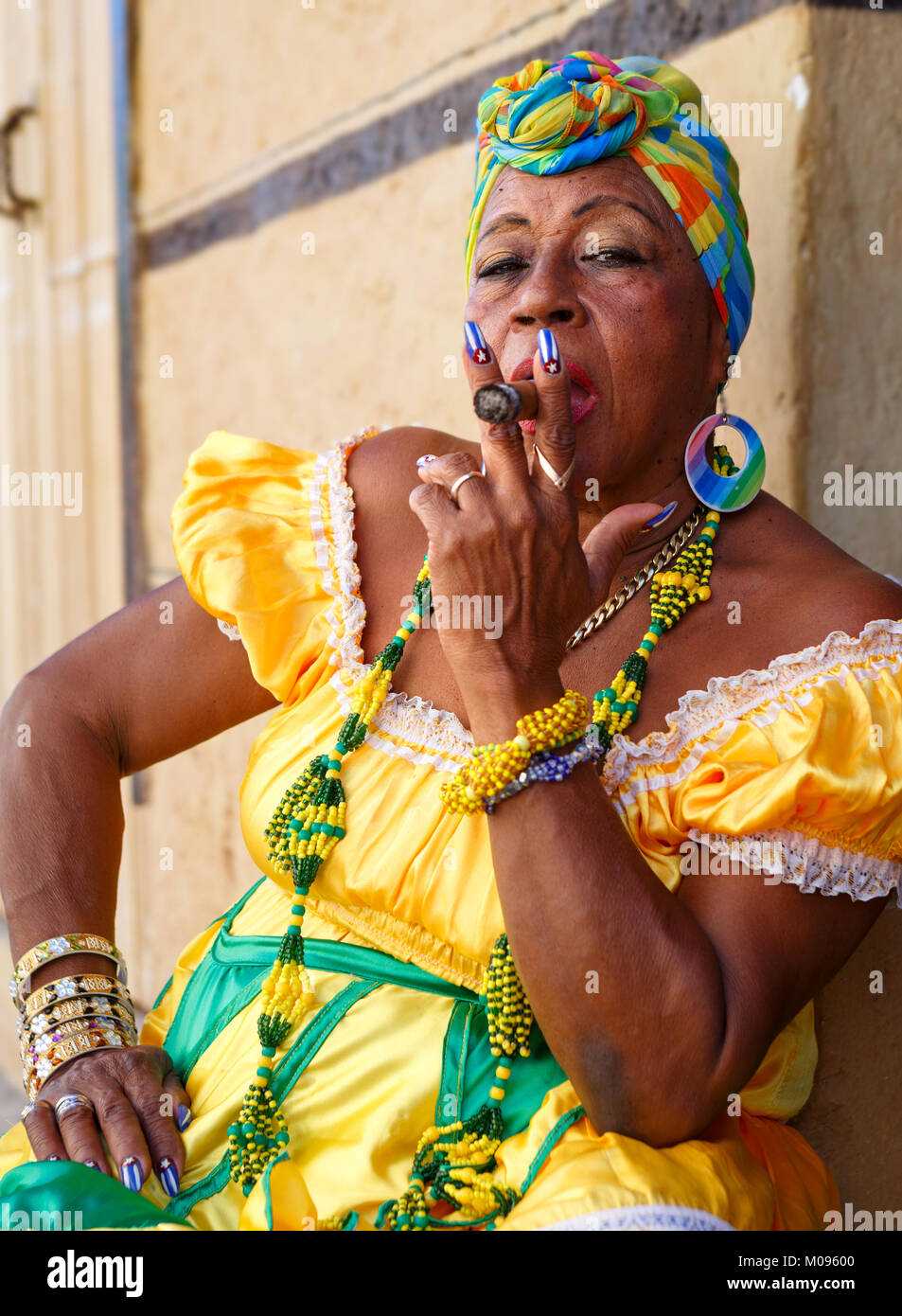 Cuban Woman with Cigar Posing for Photographs in Old Havana Stock Photo