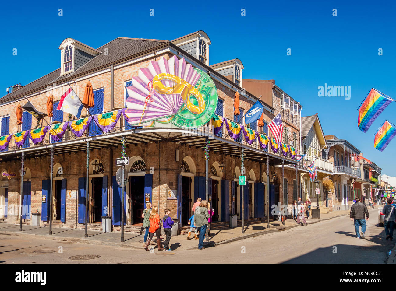 People walk in the French Quarter of New Orleans during Mardi Gras Stock Photo
