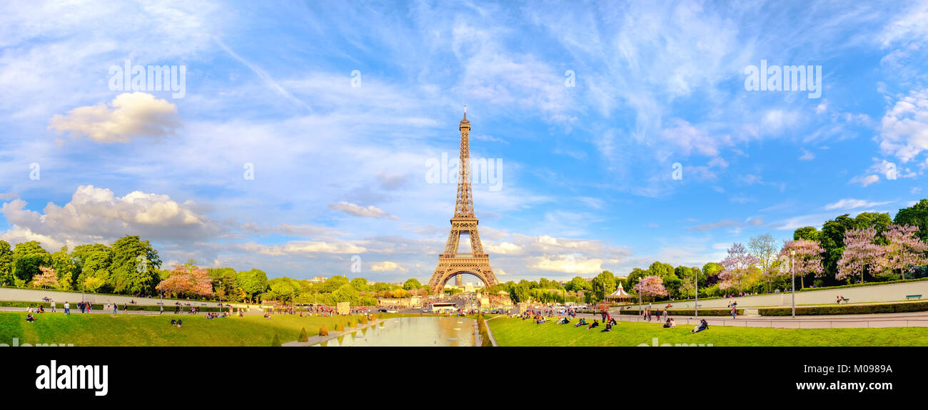 PARIS, FRANCE - MAY 14, 2017: Panoramic image of Eiffel tower on the bright sunny afternoon taken from fountains of Trocadero. This image is toned. Stock Photo