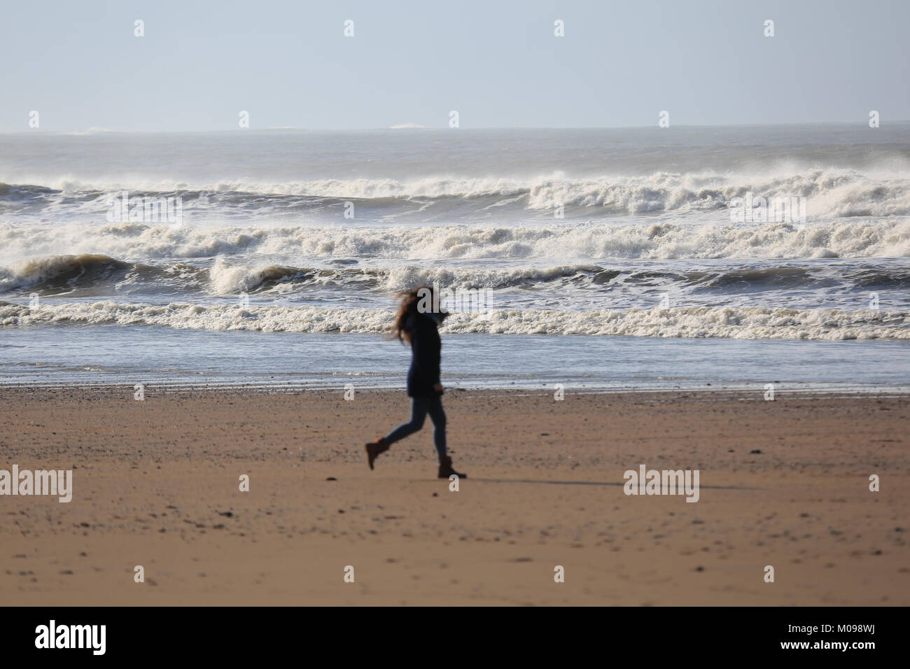 Woman walking on white beach hi-res stock photography and images - Alamy