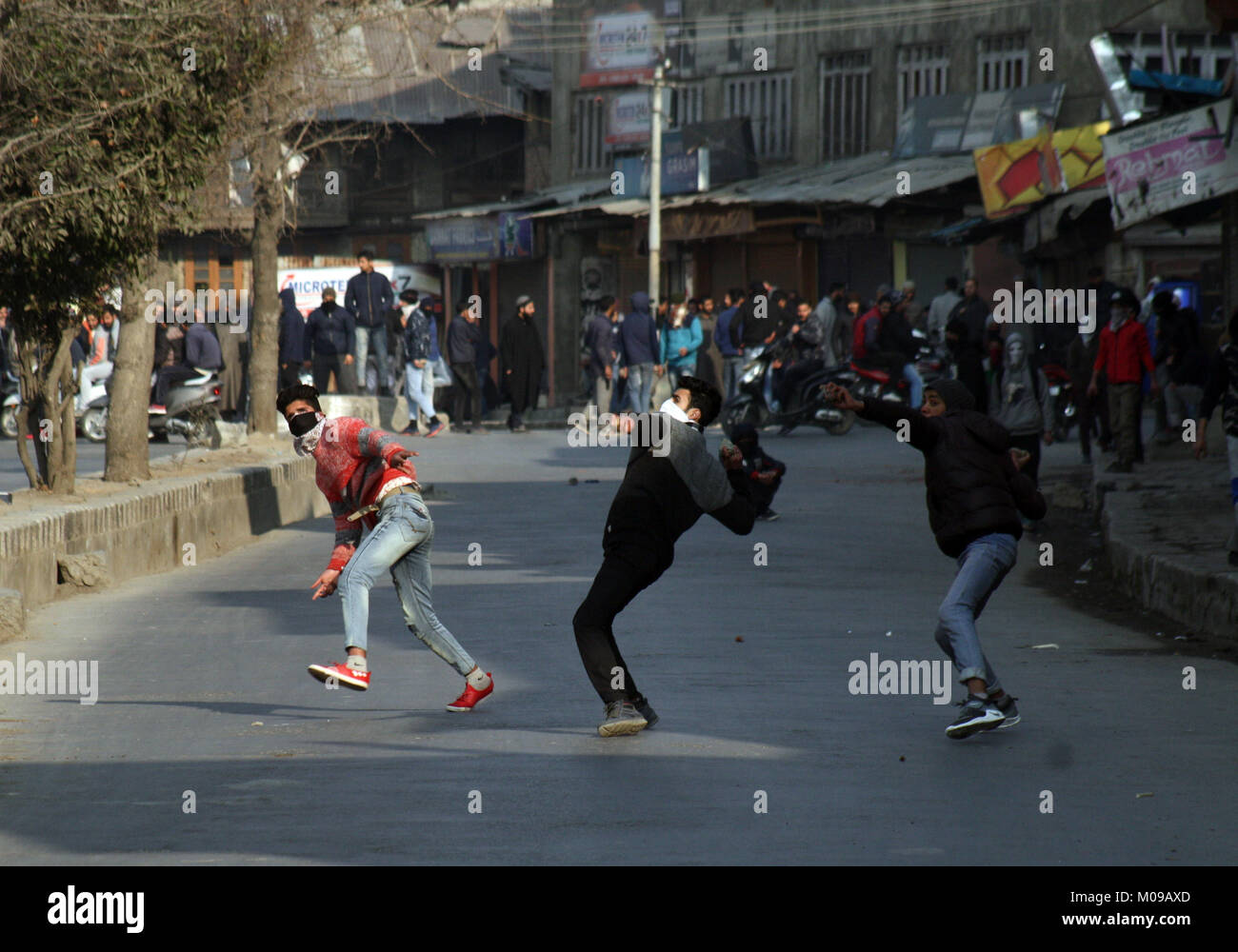 Srinagar.KASHMIR19. JANUARY masked Kashmiri protester throw stones at Indian policemen during a protest after friday prayers Indian forces used tear gas and pellet guns to disperse hundreds of stone-throwing protesters who were protesting against National Investigation Agency (NIA) chargesheet.Hafiz Lashkar-e-Taiba (LeT) Hizb-ul-Mujahideen, Syed Salahuddin and 10 accused: 7 separatists, 1 businessman, 2 stone pelters Credit: Sofi Suhail/Alamy Live News Stock Photo
