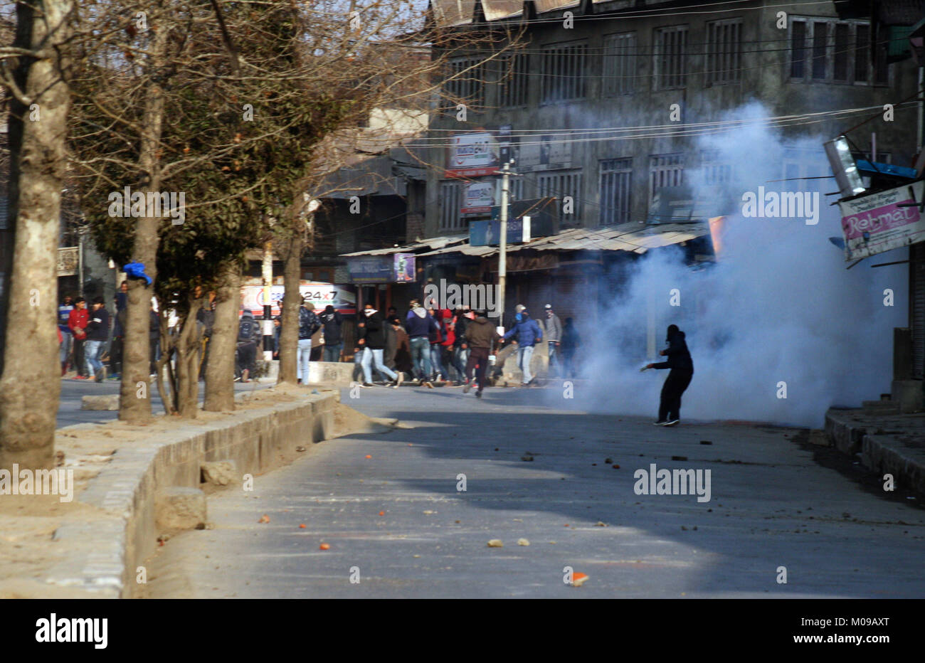 Srinagar.KASHMIR19. JANUARY A masked Kashmiri protester tryig to throwback exploded tear gas shell during a protest after friday prayers Indian forces used tear gas and pellet guns to disperse hundreds of stone-throwing protesters who were protesting against National Investigation Agency (NIA) chargesheet.Hafiz Lashkar-e-Taiba (LeT) Hizb-ul-Mujahideen, Syed Salahuddin and 10 accused: 7 separatists, 1 businessman, 2 stone pelters Credit: Sofi Suhail/Alamy Live News Stock Photo
