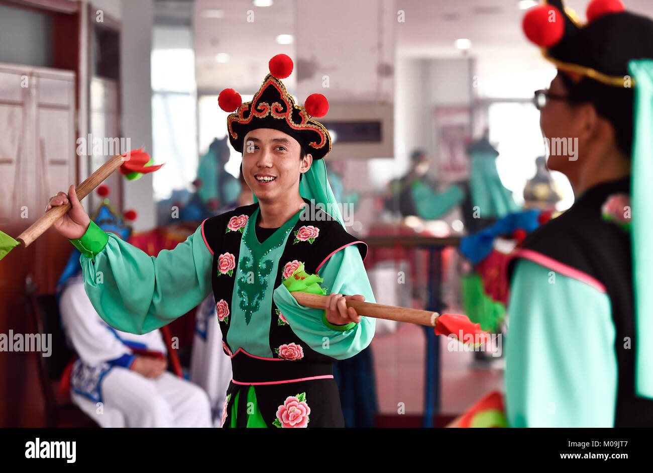 Jinan, China's Shandong Province. 19th Jan, 2018. Actors of Guzi yangge dance troupe rehearse at a culture center in Shanghe County, east China's Shandong Province, Jan. 19, 2018. Invited by the China Cultural Center in Stockholm, the troupe will participate in Spring Festival celebration events in Sweden from Feb. 9 to 14. Credit: Guo Xulei/Xinhua/Alamy Live News Stock Photo