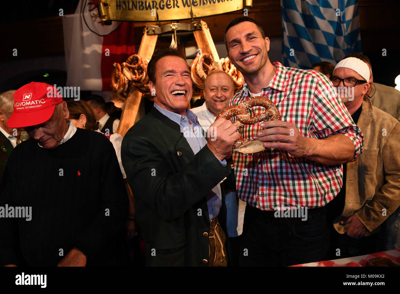 Going, Germany. 19th Jan, 2018. Actor Arnold Schwarzenegger (L) and boxer Wladimir Klitschko attend the 27th traditional 'Weisswurst party' (lit. Bavarian white sausage party) at the Stanglwirt Inn in Going, Germany, 19 January 2018. The 'Weisswurst party' is an event where stars and celebrities meet a day before the legendary Hahnenkamm downhill race. Credit: Felix Hörhager/dpa/Alamy Live News Stock Photo