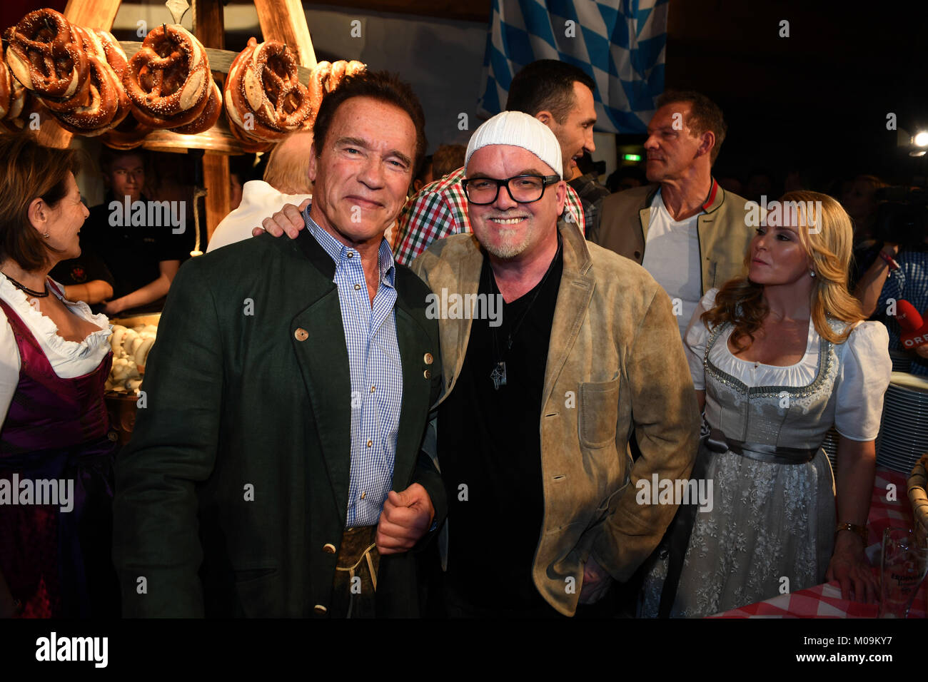 Actor Arnold Schwarzenegger (L) and musician  Anton Friedle (also known as DJ Oetzi) attend the 27th traditional 'Weisswurst party' (lit. Bavarian white sausage party) at the Stanglwirt Inn in Going, Germany, 19 January 2018. The 'Weisswurst party' is an event where stars and celebrities meet a day before the legendary Hahnenkamm downhill race. Photo: Felix Hörhager/dpa Stock Photo