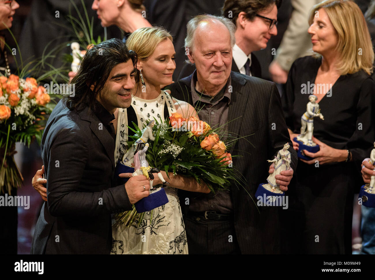 Munich, Germany. 19th Jan, 2018. Film director Fatih Akin (L-R), actress Diane Kruger and director Werner Herzog stand next to each holding their trophies in their hands after the award ceremony of the Bavarian Film Prize 2017 in Munich, Germany, 19 January 2018. Akin (Best Director) and Kruger (Best Actress) were both awarded for their new film 'In the Fade' (Aus dem Nichts) and Herzog received the honourary award of the Bavarian Premier. Credit: Ursula Düren/dpa/Alamy Live News Stock Photo