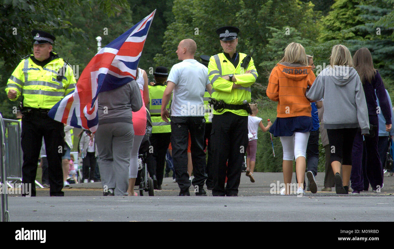 police officers presence Glasgow Rangers orange order celebration flag in kelvingrove Glasgow British nationalism union jack flag celebration Stock Photo