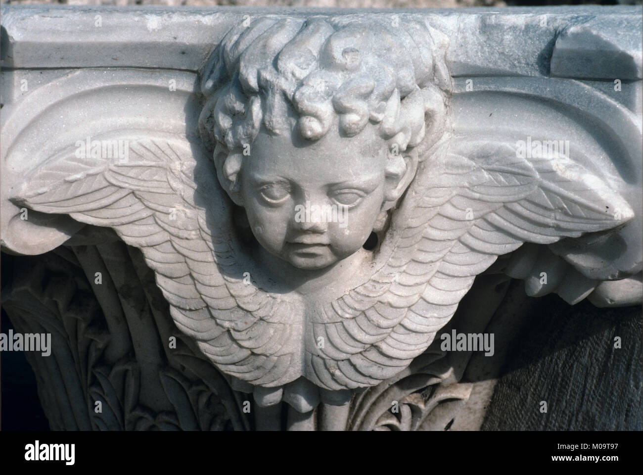 Cherub or Winged Angel Classical Marble Capital Architectural Detail from the Ancient Classical Greek City of Kyssos or Kysos, or Roman Cysus, modern-day Cesme, near Izmir, Turkey Stock Photo