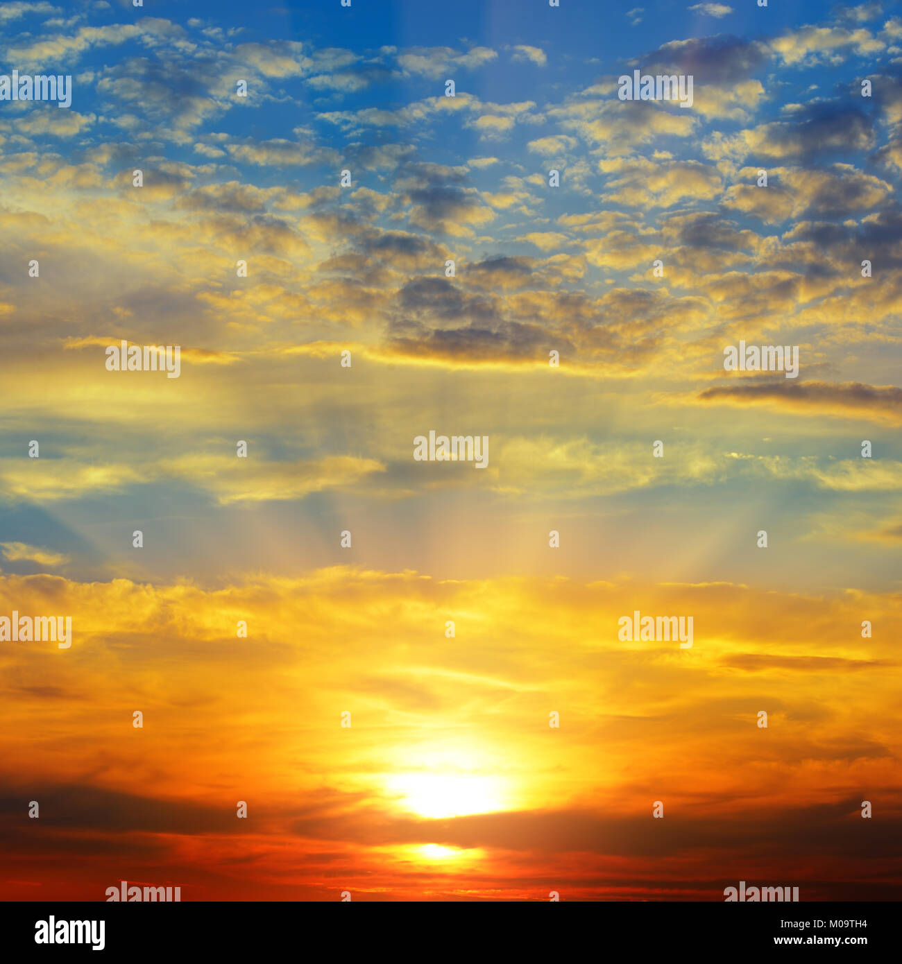 Sunset over the horizon. Sky with colored clouds Stock Photo - Alamy