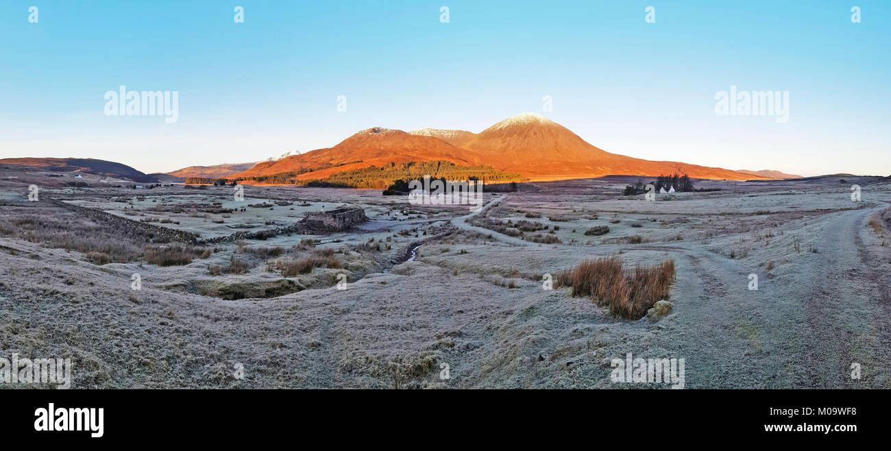 Views across to the Red Cuillin Mountains on the Isle of Skye. The Islands are a magnet for walkers, hikers and climbers even in the harshness of a Scottish winter. Stock Photo