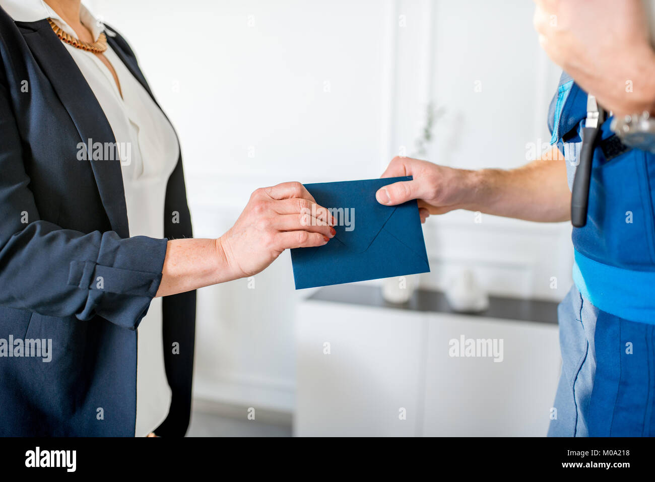 Giving salary in envelope to the worker Stock Photo Alamy