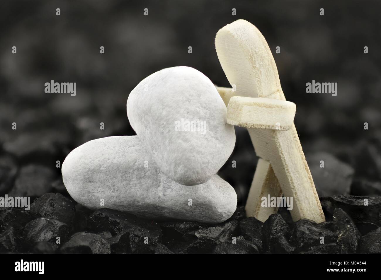 Male is stacking white pebbles on each other Stock Photo
