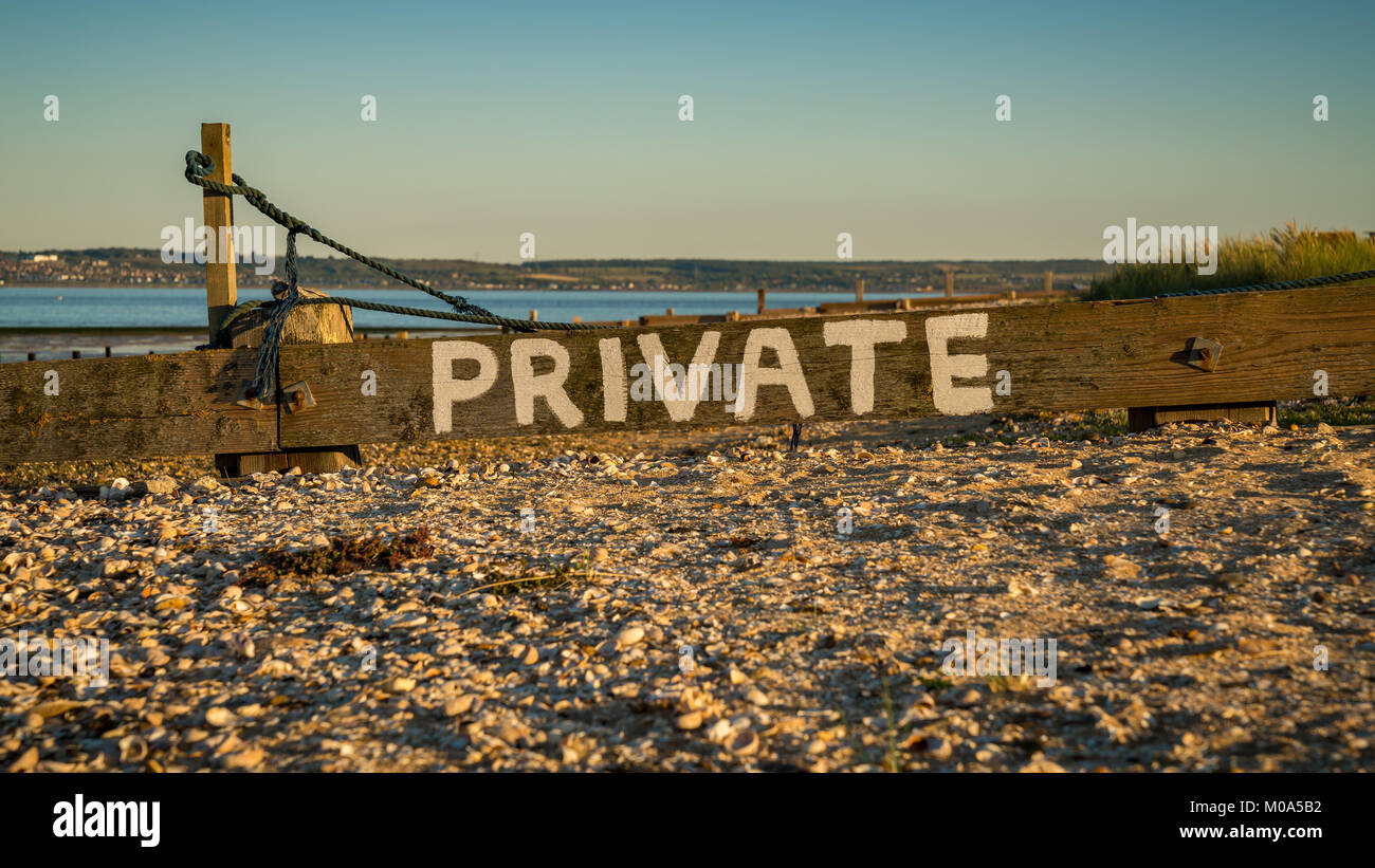 Sign: Private, seen at Shellness Beach on the Isle of Sheppey, Kent, England, UK Stock Photo