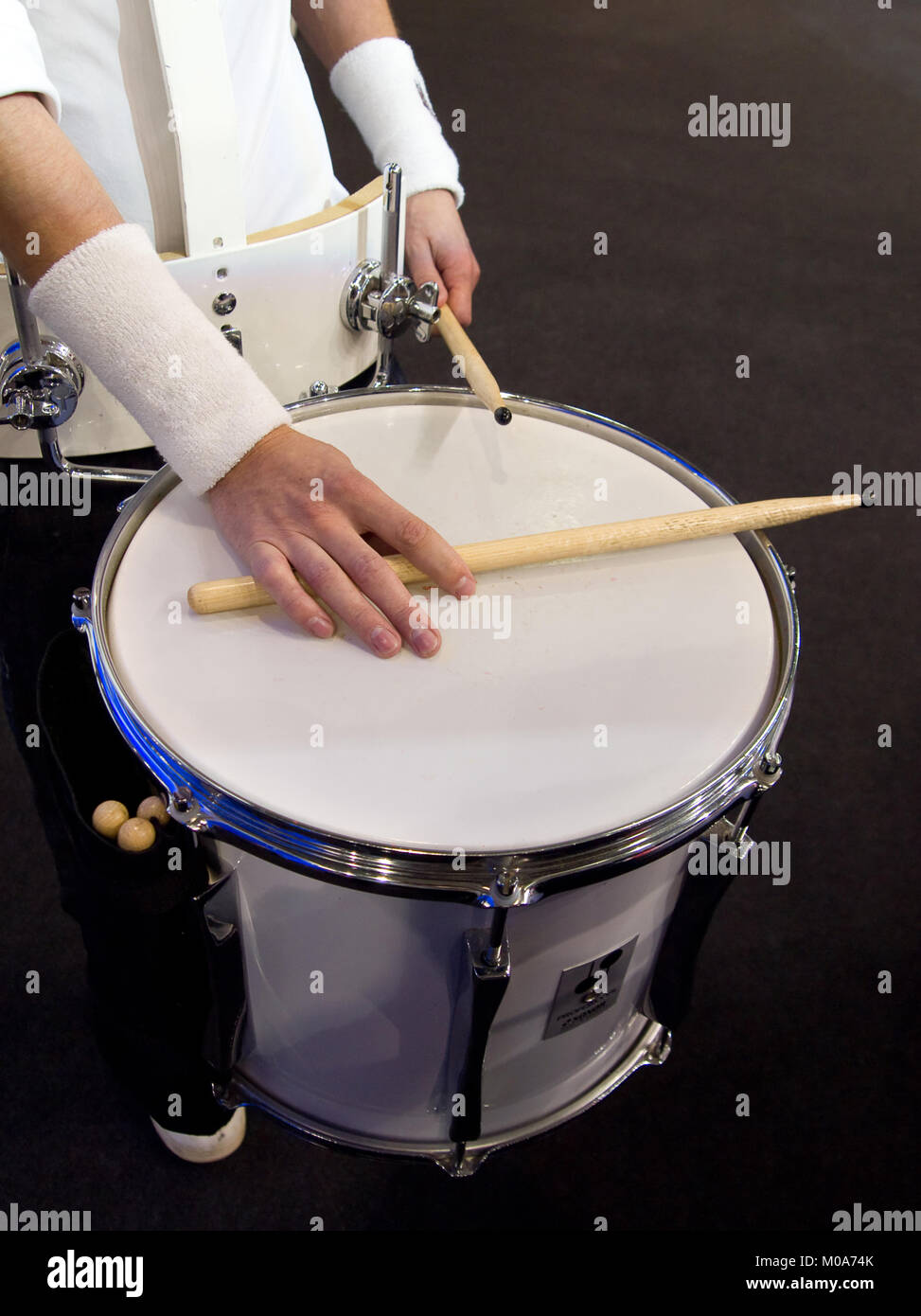 Hand drummer with drum sticks lying on the drum Stock Photo Alamy