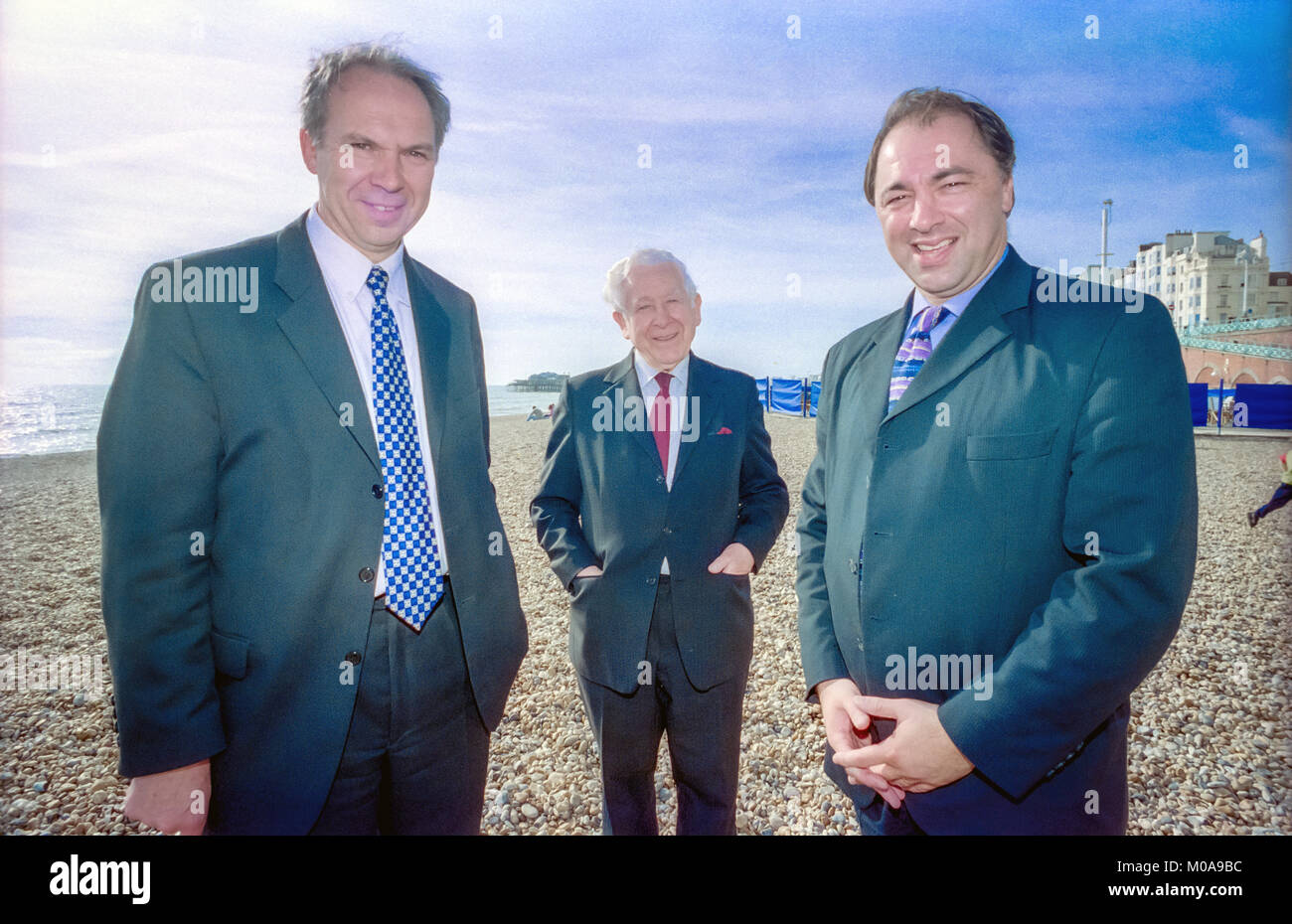 Bernie Jordan, aged 72, centre, a well-known local Conservative Party member, defects to the Labour Party, with Lord Bassam, left, and Ivor Caplin MP, right. Stock Photo