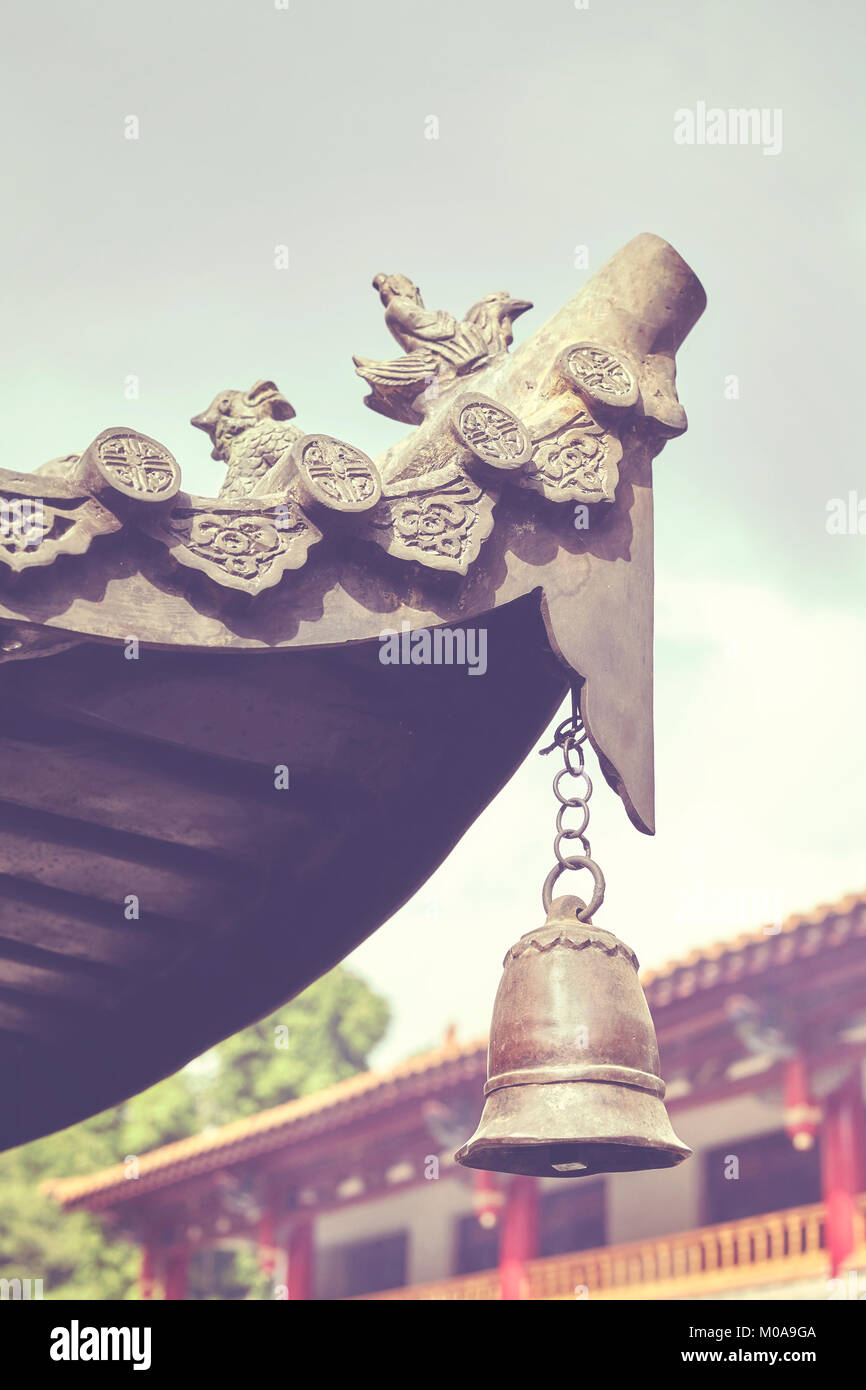 Color toned picture of a temple bell, selective focus, China. Stock Photo