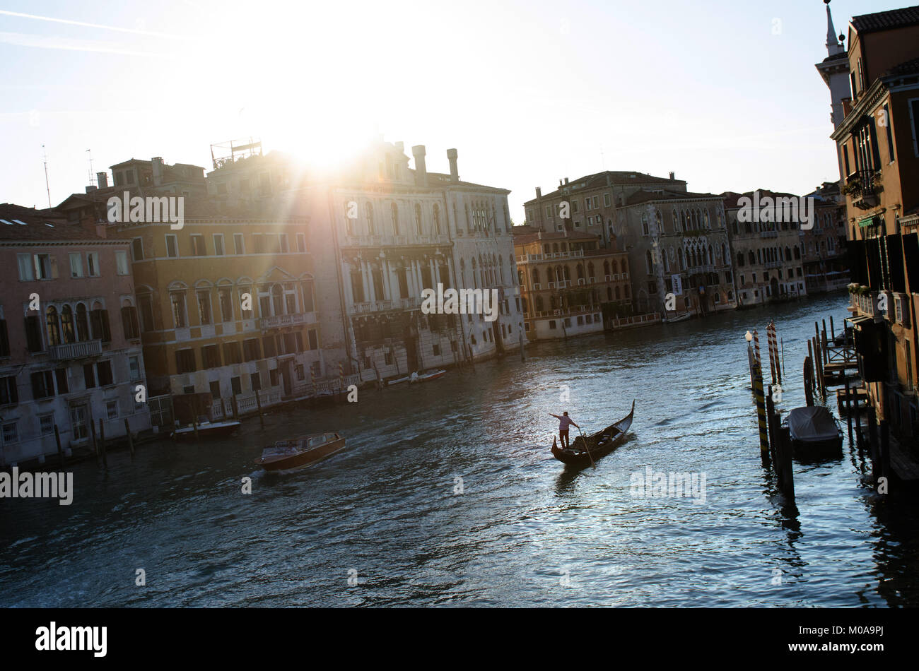 A man rows a Gondola along the Grand Canal in Venice, Italy, May 10, 2015. (Photo by Rod Lamkey Jr.) Stock Photo