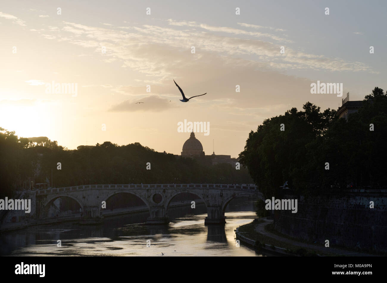 The sun sets over the River Tiber as the Vatican can be seen off in the distance in Rome, Italy, May 25, 2015. (Photo by Rod Lamkey Jr.) Stock Photo