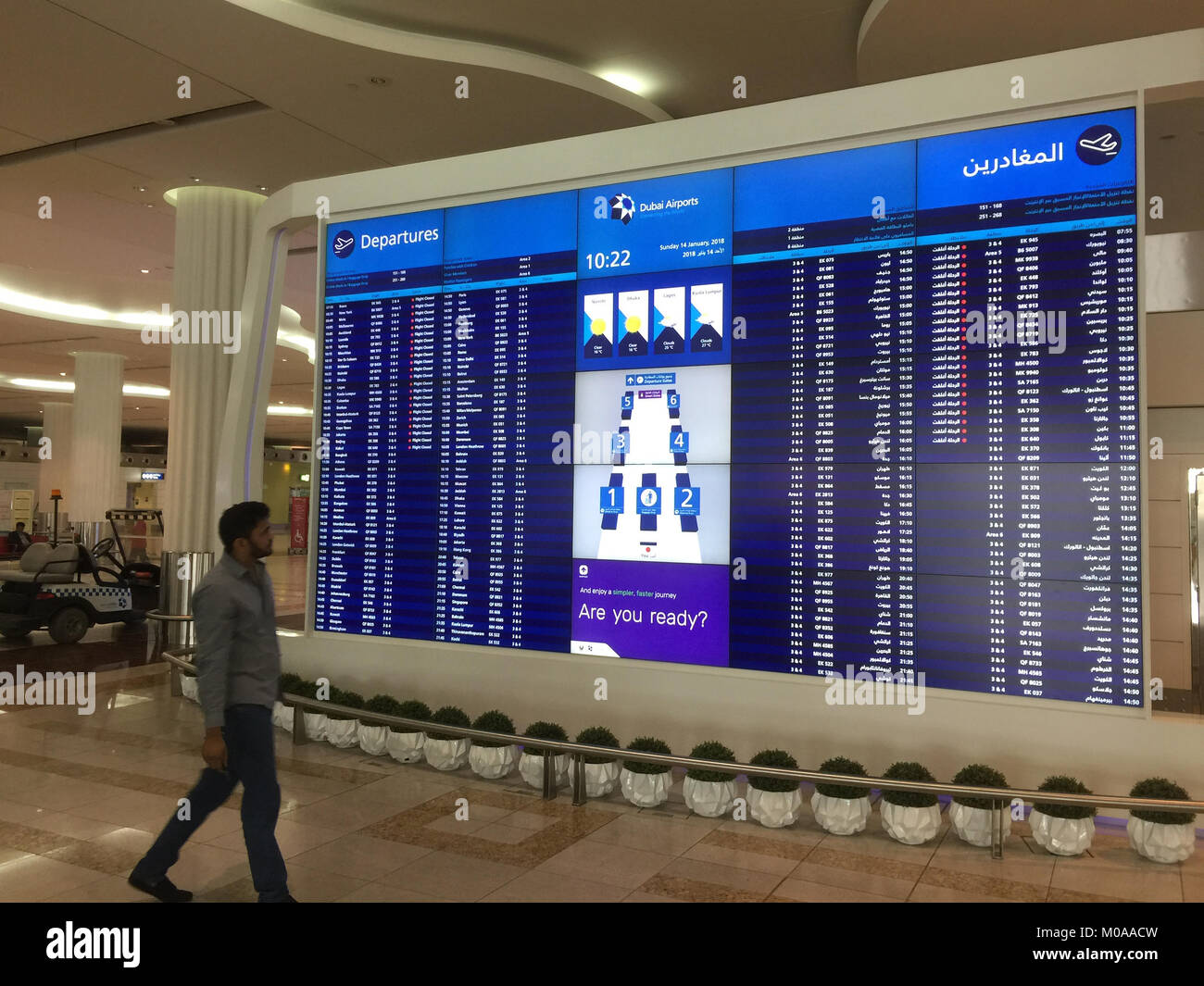 DUBAI INTERNATIONAL AIRPORT departures board. Photo: Tony Gale Stock Photo