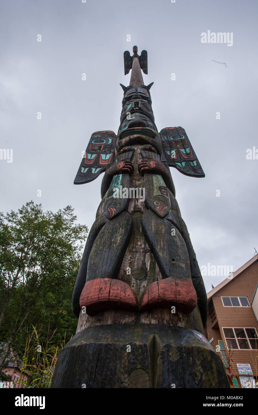 Tall wooden totem pole in Alaska Stock Photo - Alamy