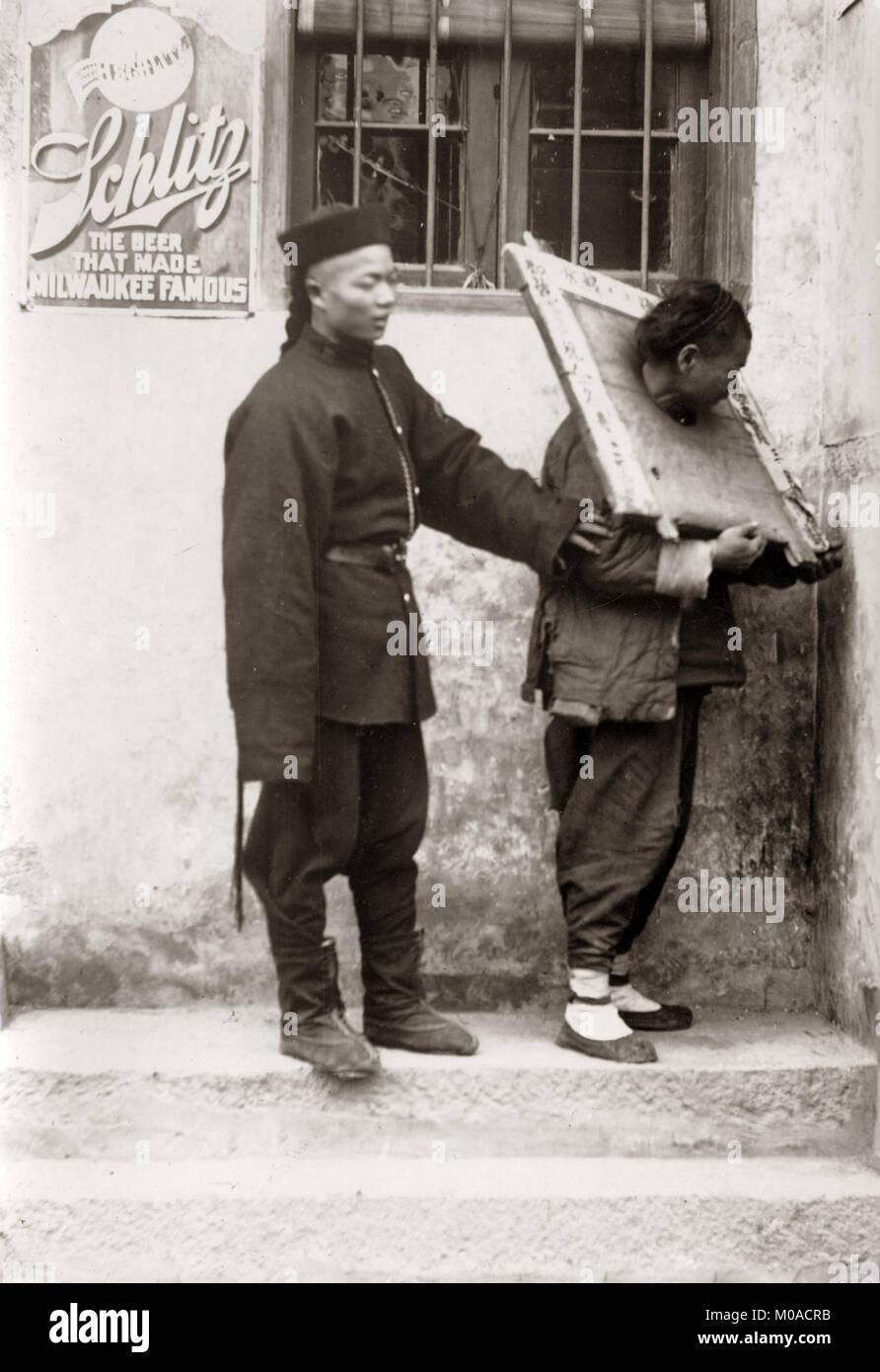 c.1890 China - Chinese types and trades - street vendor - prisoner in cangue and guard Stock Photo