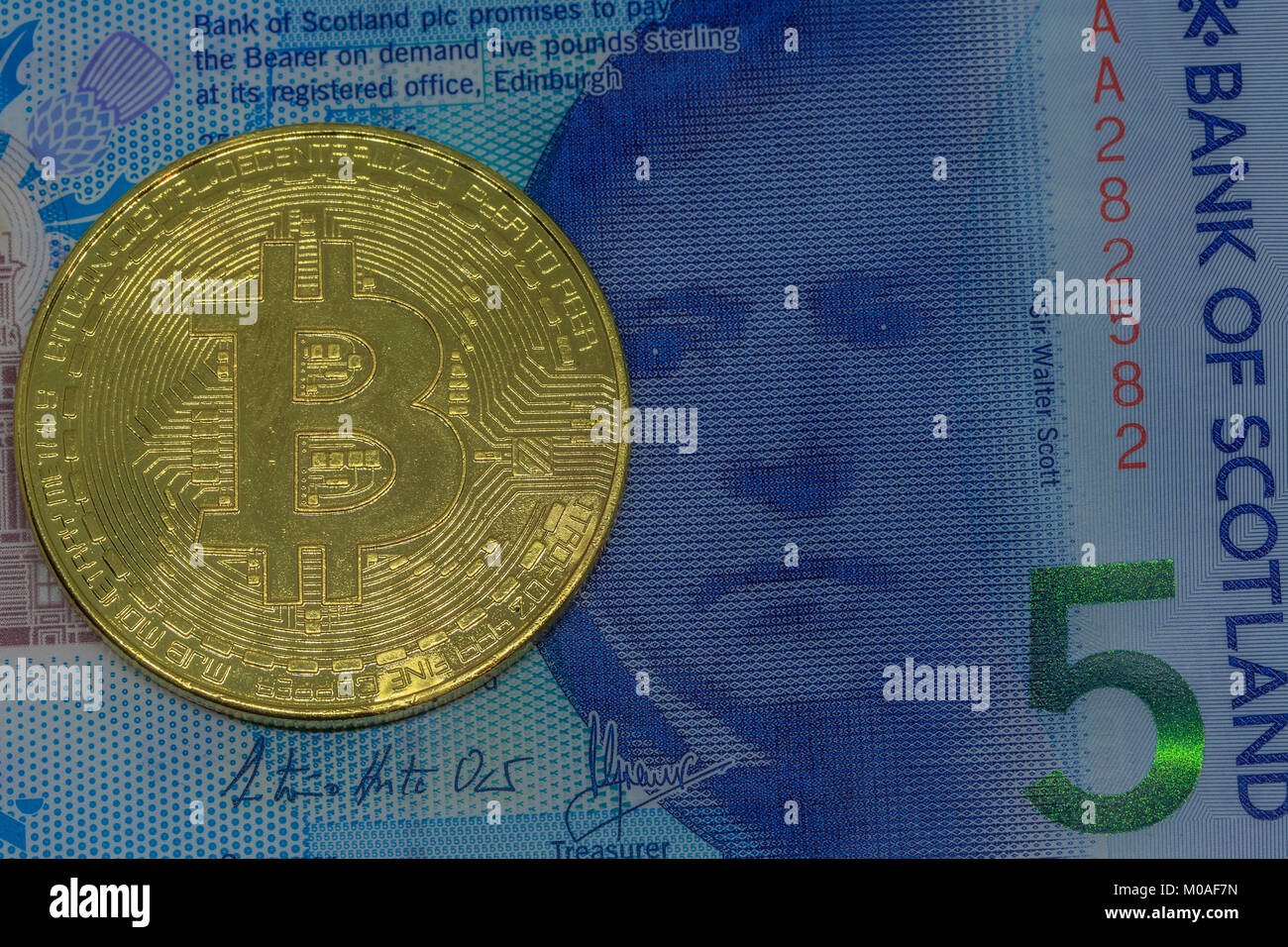Bitcoin on Scottish 5 pound banknote Stock Photo