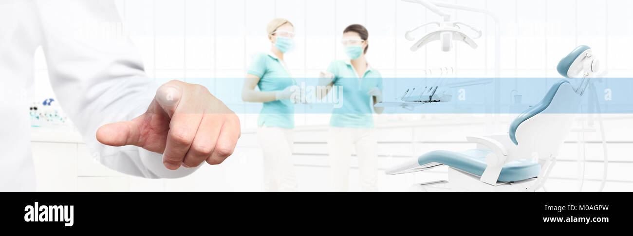 Dentist Hand Touch Screen On Dental Clinic With Dentist S Chair