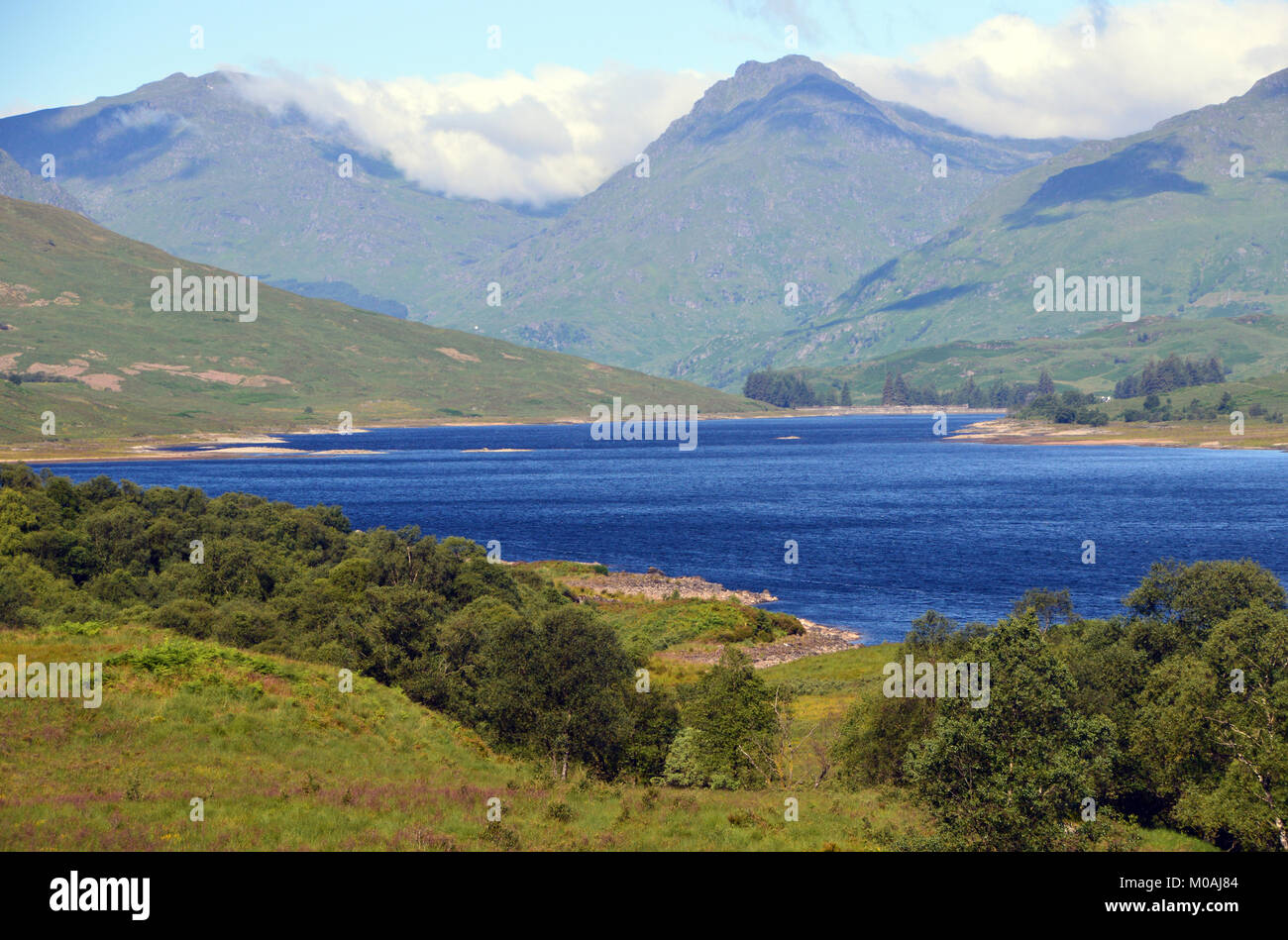 The Scottish Mountain Munros Beinn Ime and Ben Vane from Loch Arklet in the Scottish Highlands, UK. Stock Photo