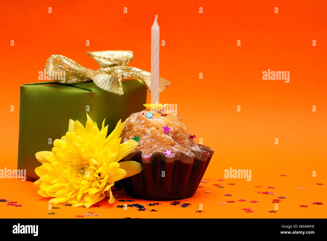 Birthday cupcake, gift and flower - holiday background Stock Photo - Alamy