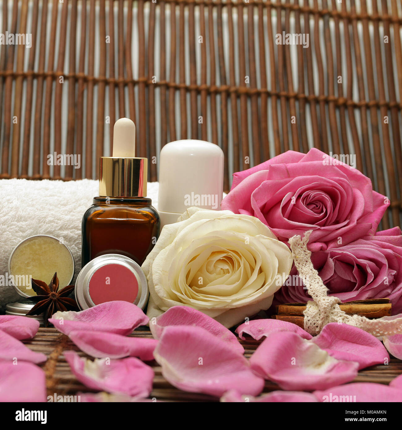 Natural cosmetics with pink roses, petals, honey and cinnamon Stock Photo