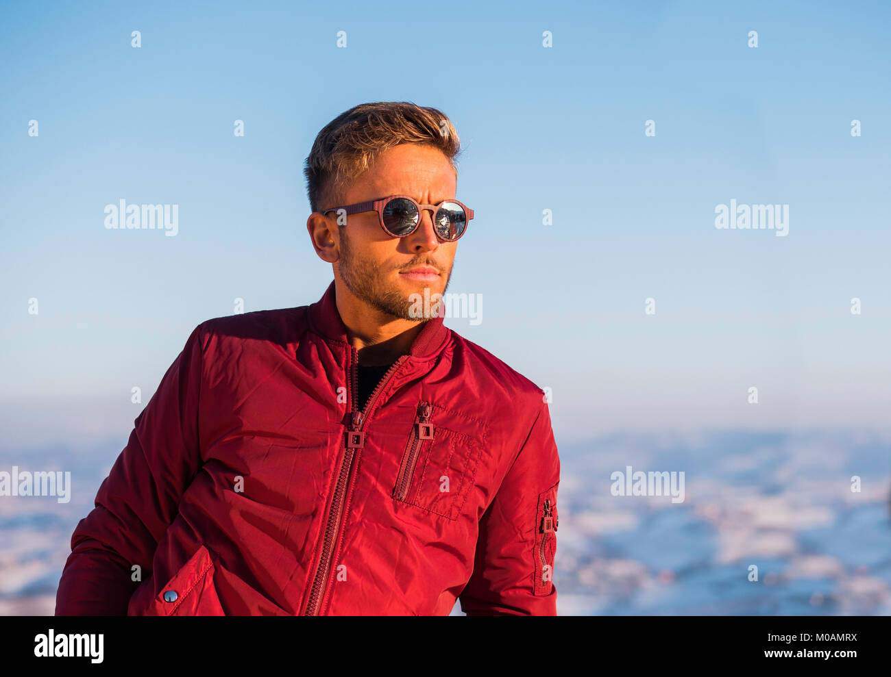 Handsome young man outdoor in winter fashion Stock Photo - Alamy