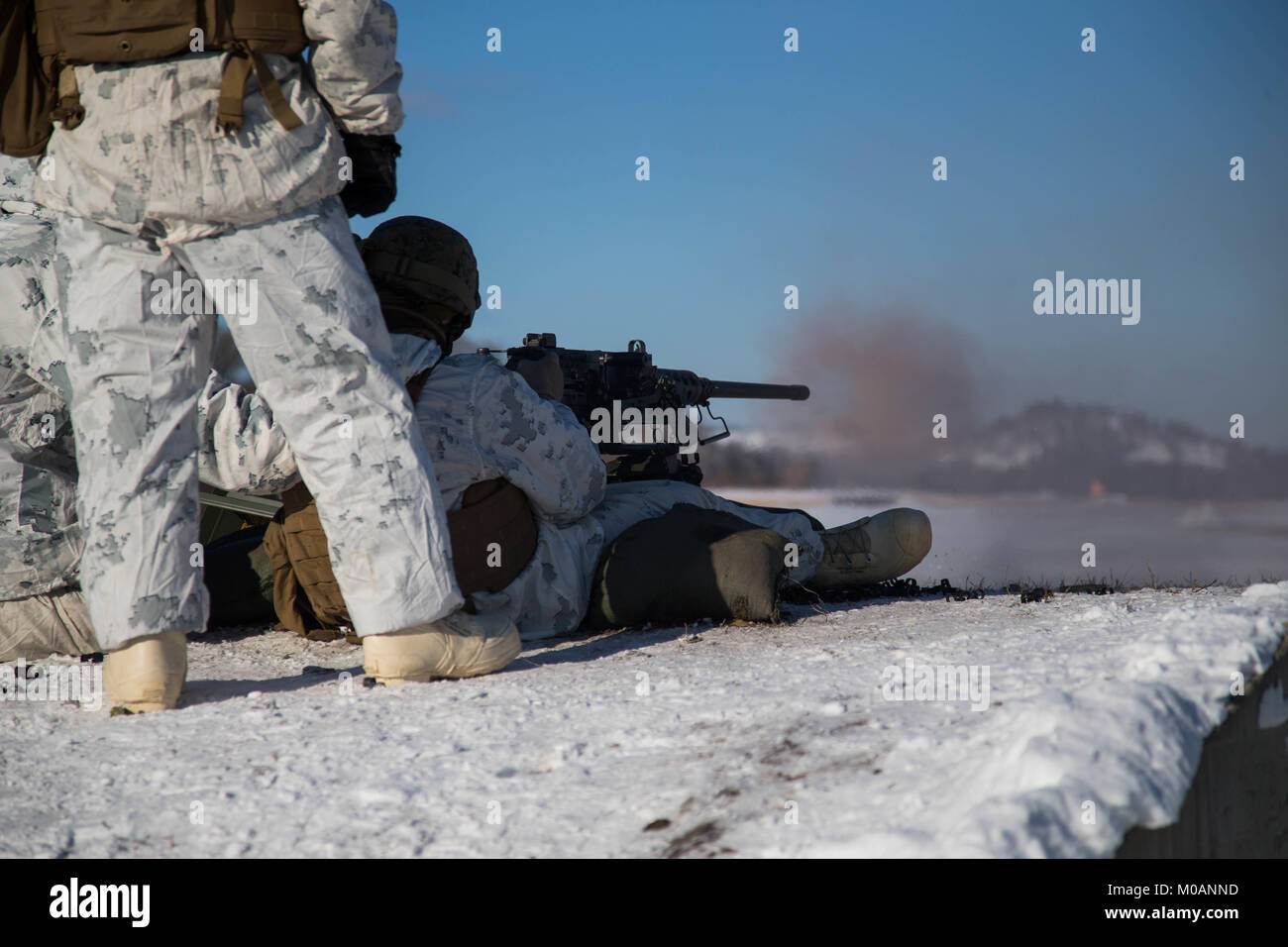 U.S. Marines assigned to Marine Air Control Group 28 fire M240B machine guns down during Ullr Shield on Fort McCoy, Wis., Jan. 16, 2018. Stock Photo