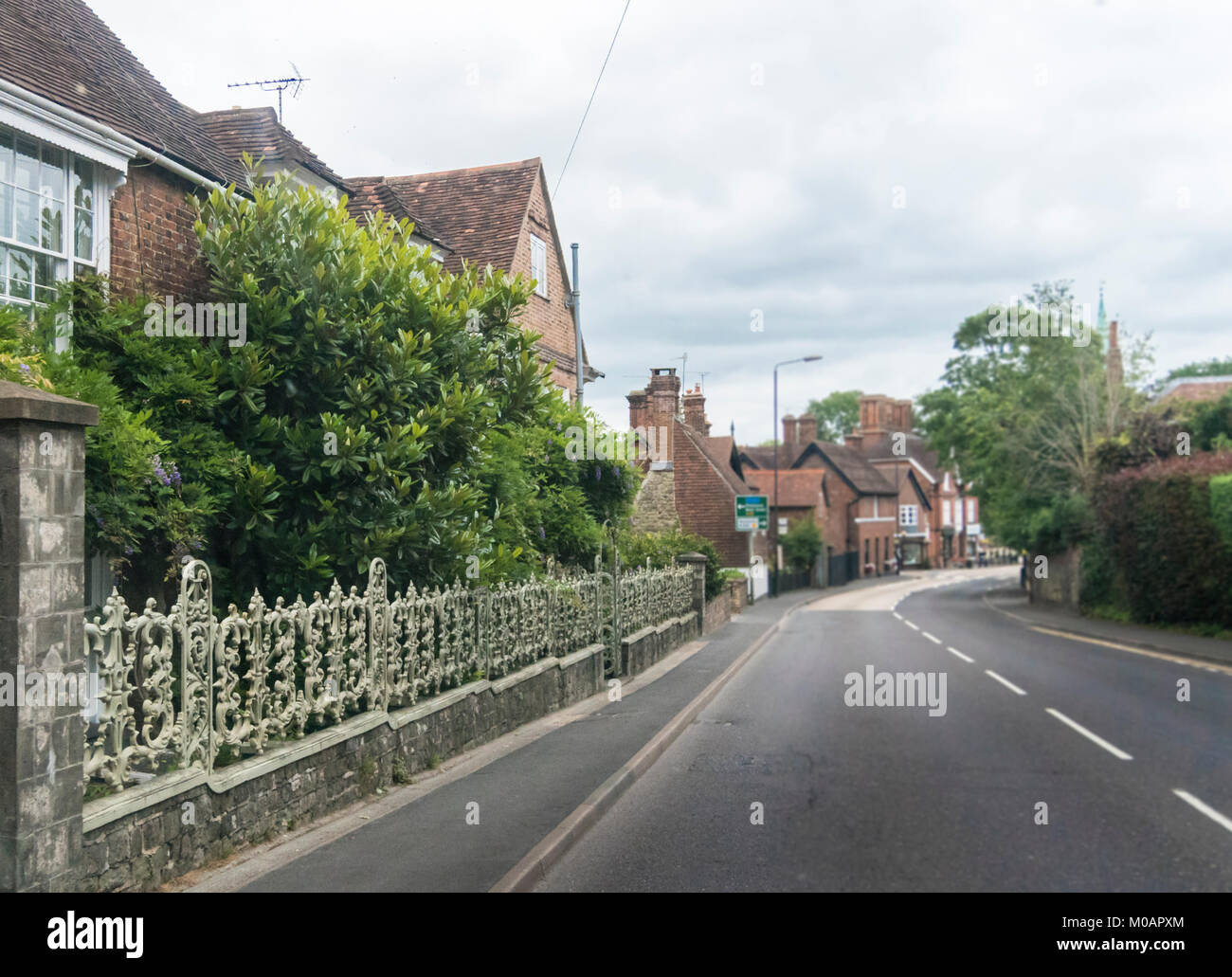 Street view of an ornate wrought iron garden fence, Riverhead, Kent, UK Stock Photo Alamy