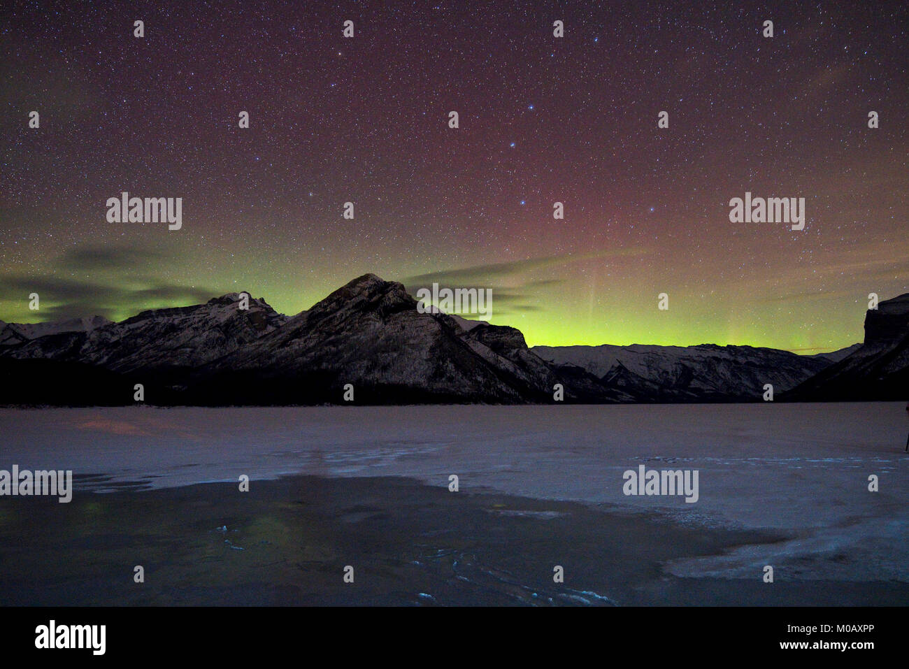 Northern lights over Lake Minnewanka, Alberta, Canada Stock Photo Alamy