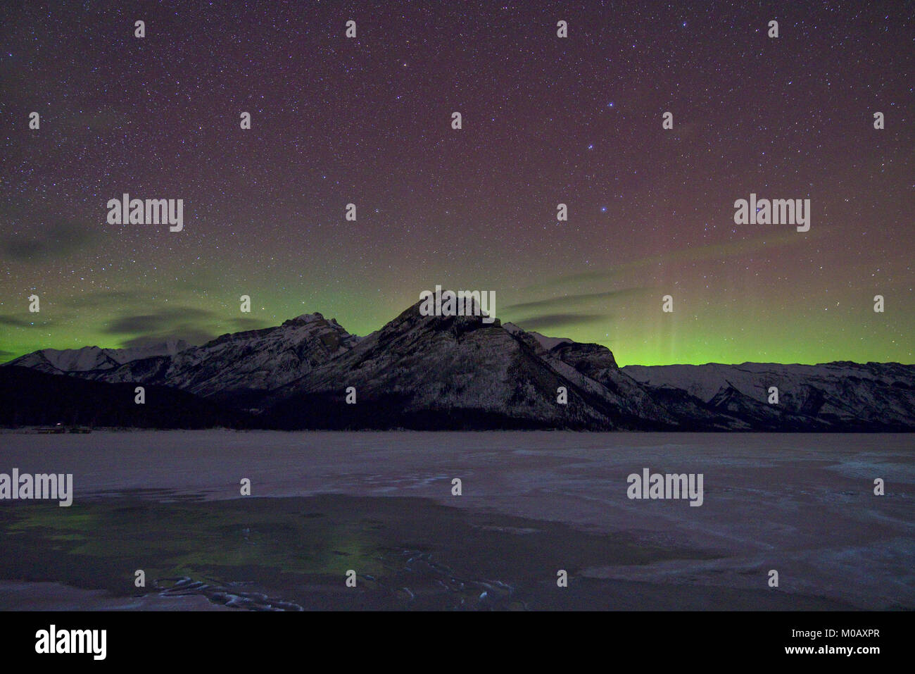 Northern lights over Lake Minnewanka, Alberta, Canada Stock Photo Alamy