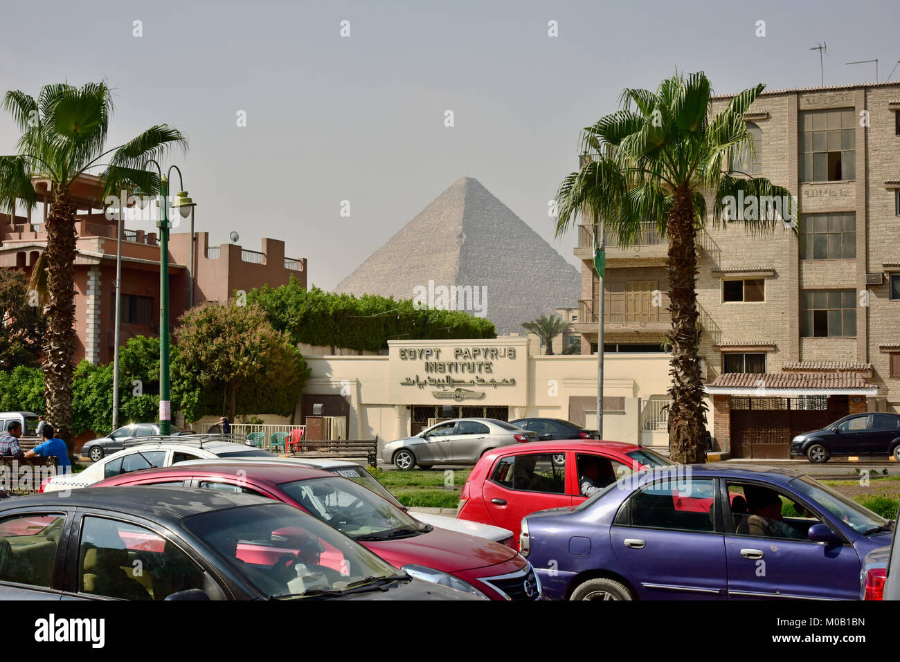The Great Pyramid of Giza (also known as the Pyramid of Khufu, or the Pyramid of Cheops) as seen from across from the Egypt Papyrus Institute in Giza. Stock Photo