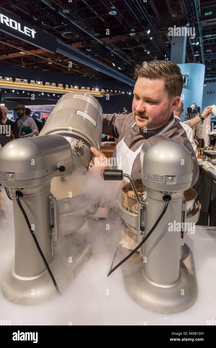 Detroit, Michigan - A worker makes ice cream with liquid nitrogen at -320 degrees F (-196C) during the North American International Auto Show. Stock Photo