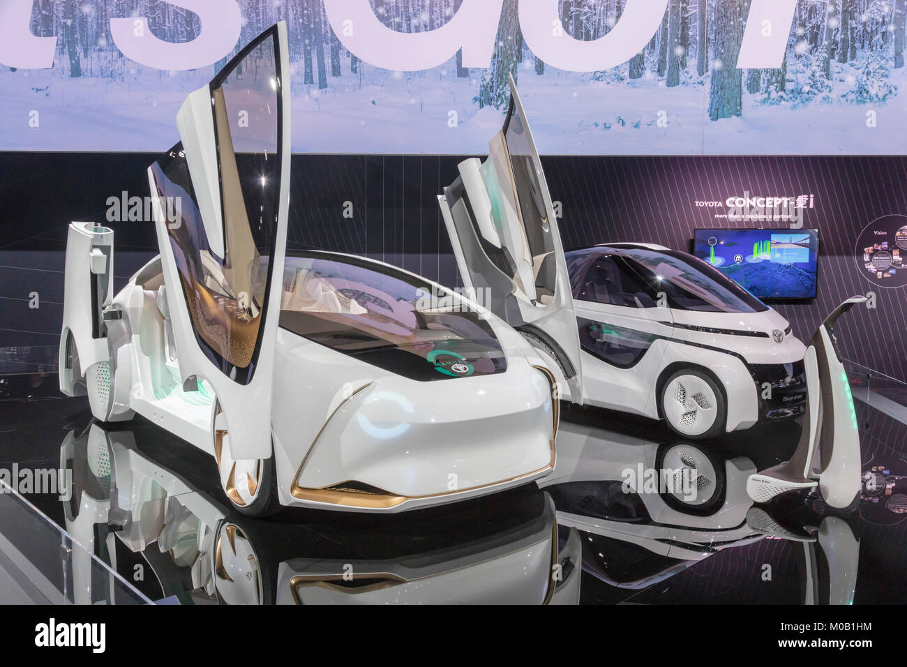 Detroit, Michigan - Toyota's Concept-i self-driving car (left) on display at the North American International Auto Show. At right is the two-seater Co Stock Photo