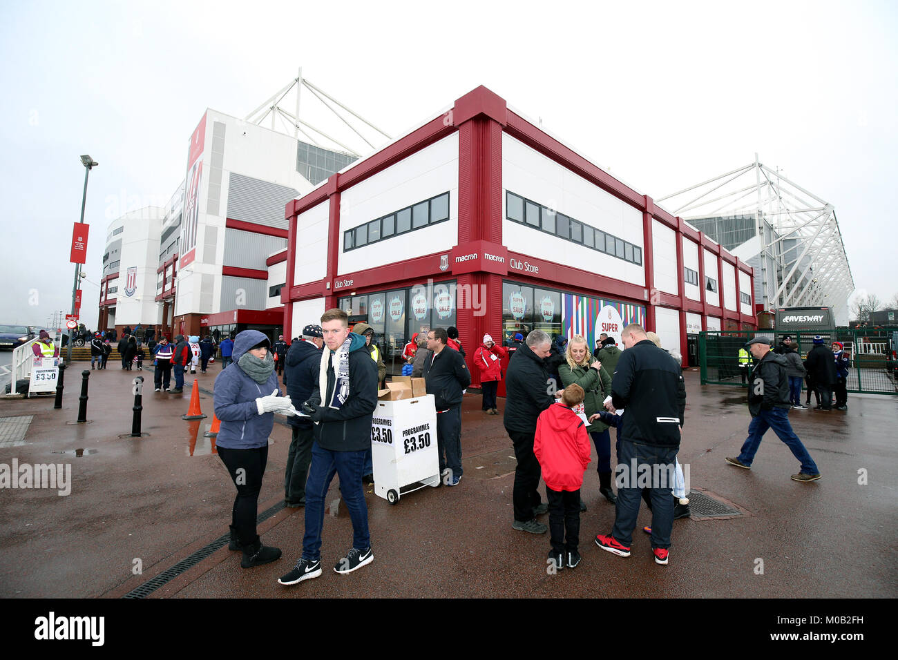 Fans buy match programmes before the Premier League match at the bet365 ...