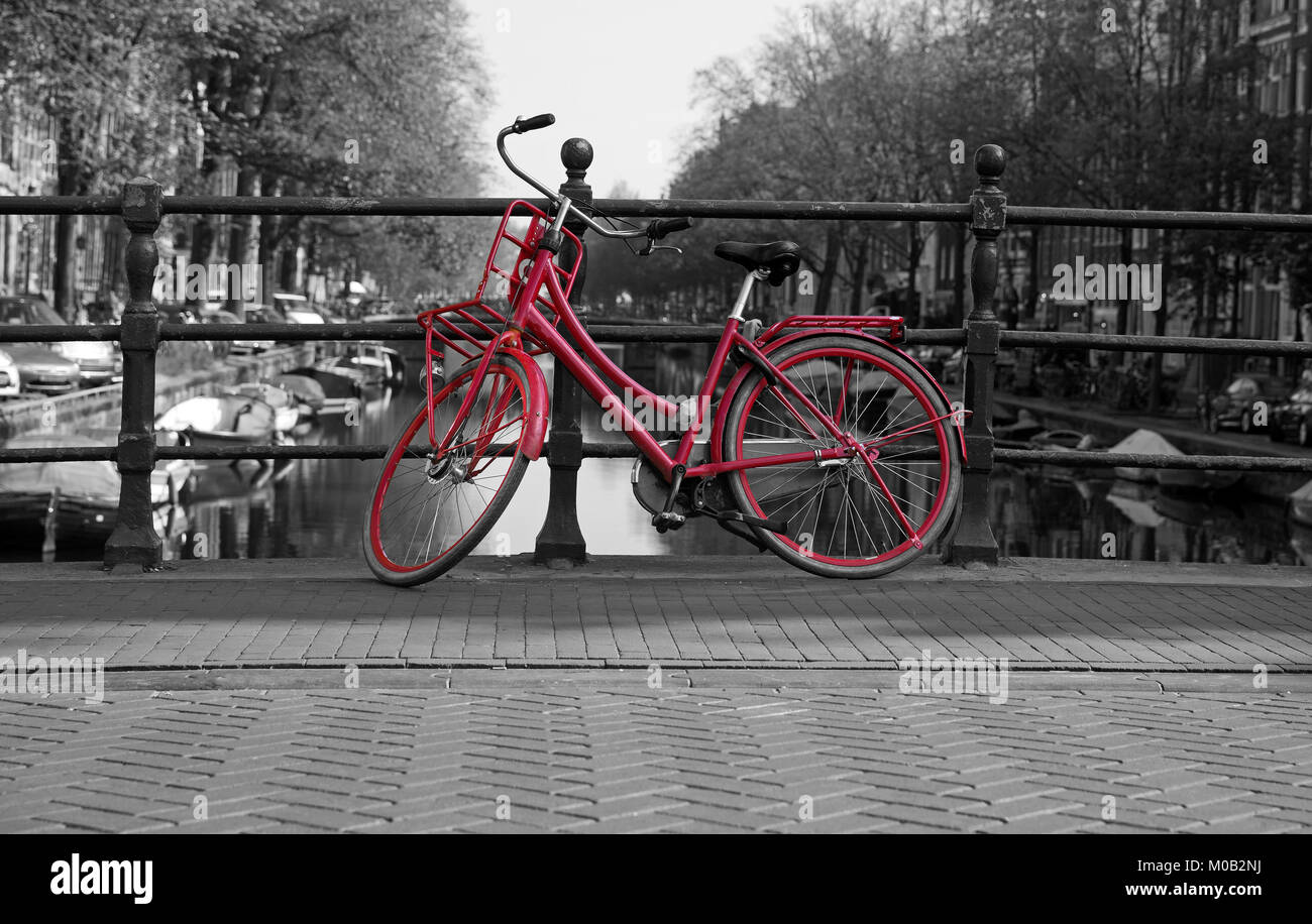 Black and white Amsterdam with red bicycle Stock Photo