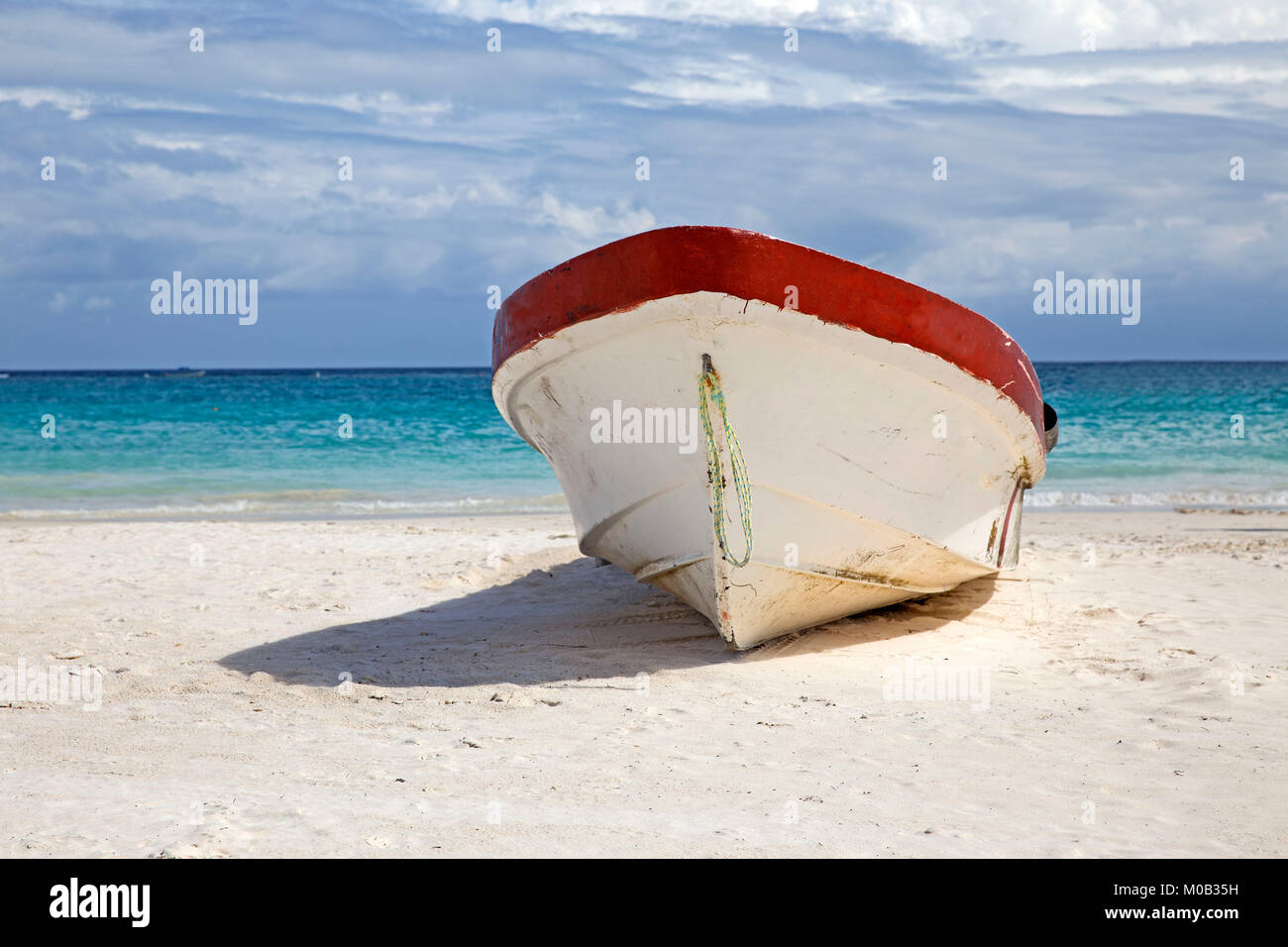 Wooden old fishing boat on caribbean beach Stock Photo - Alamy