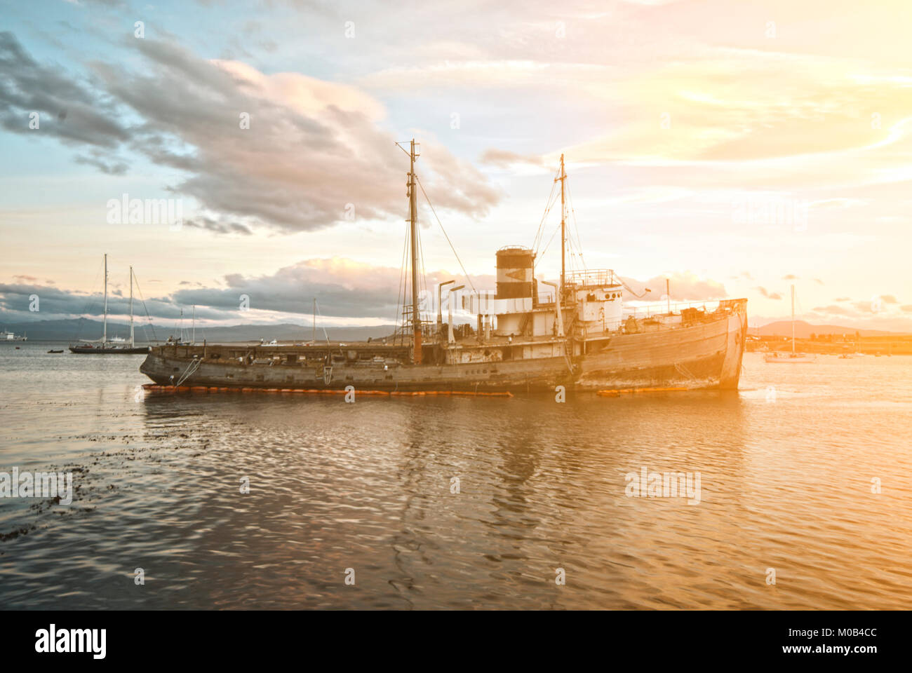 Shipwreck in the Ushuaia harbor with a dramatic sky in the background, Ushuaia Tierra del Fuego Argentina Stock Photo