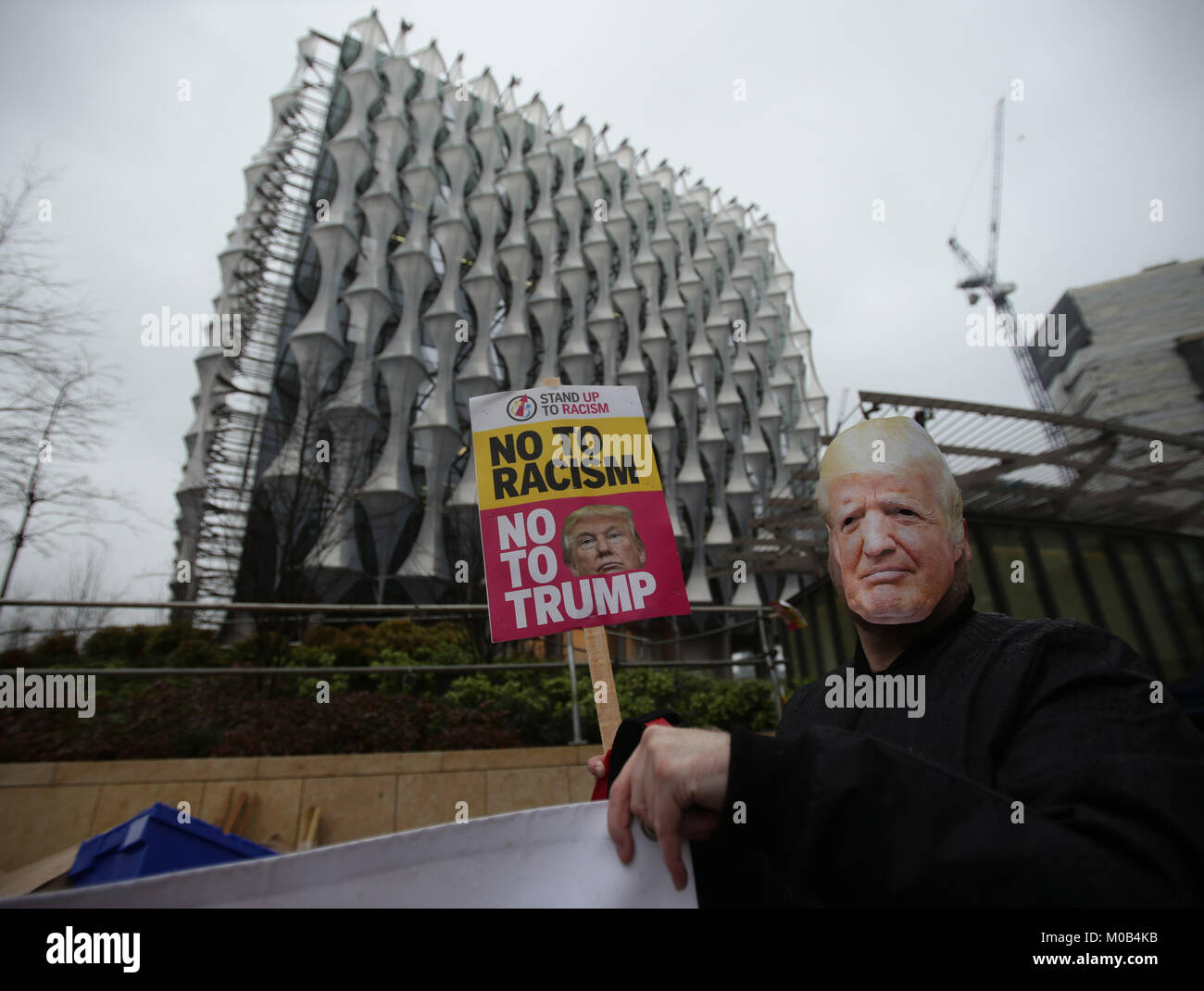 Anti-Trump protesters outside the new US Embassy in Nine Elms, London, as the demonstration organised by Stand Up To Racism, marks the first anniversary of Donald Trump being sworn in as the 45th President of the United States. Stock Photo