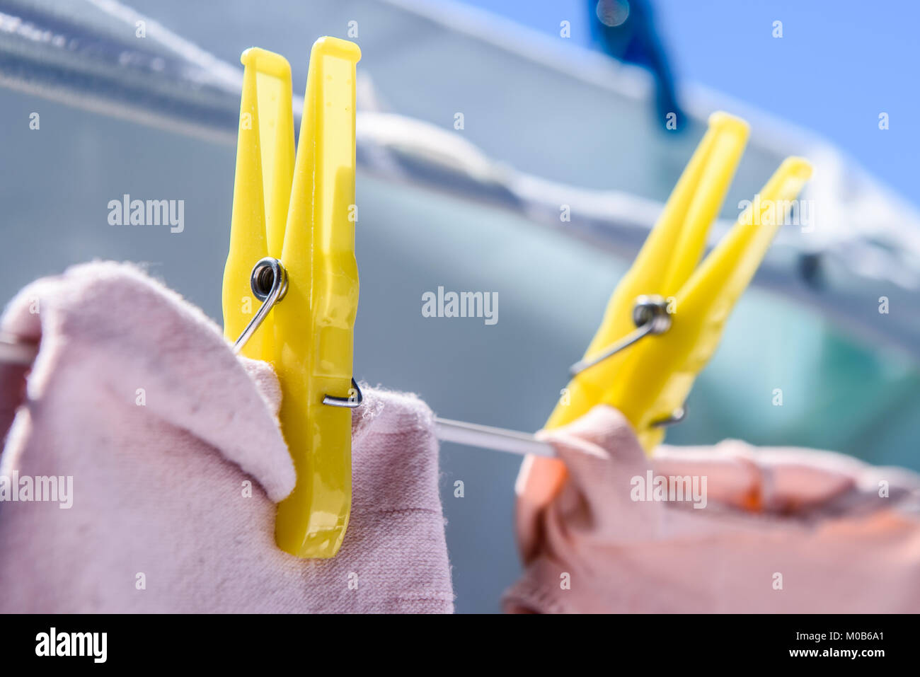 Clothes drying with clothes peg on balcony Stock Photo Alamy