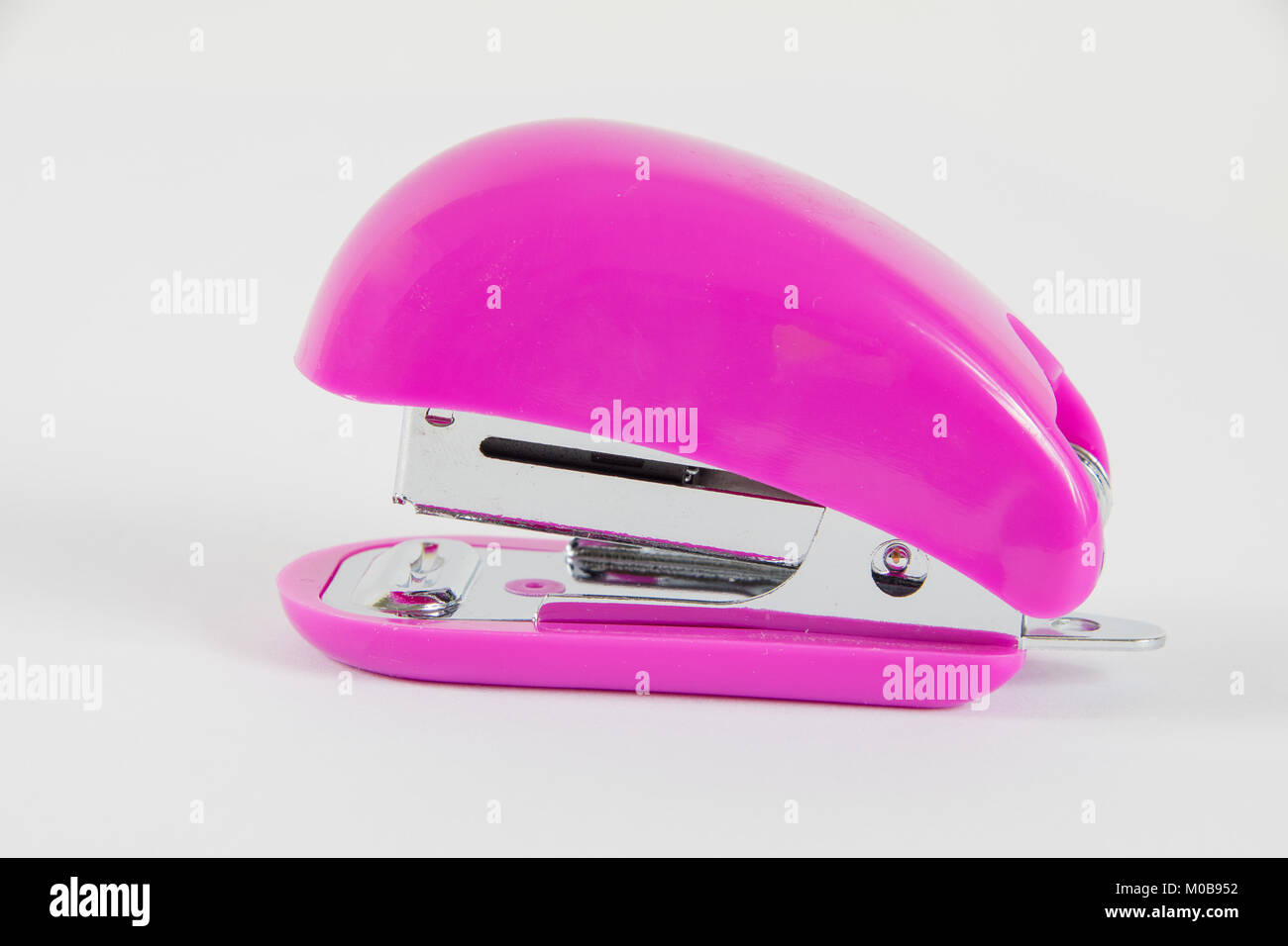 Small Pink Stapler on a white background Stock Photo - Alamy