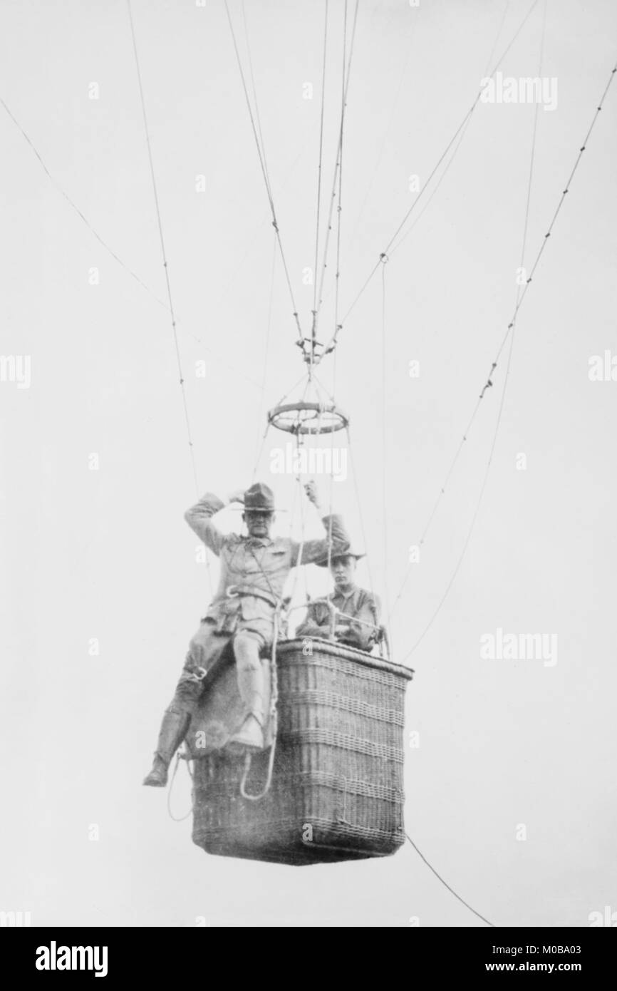 Balloon jump by a parachutist hanging from a basket suspended by it but out of the image. Stock Photo