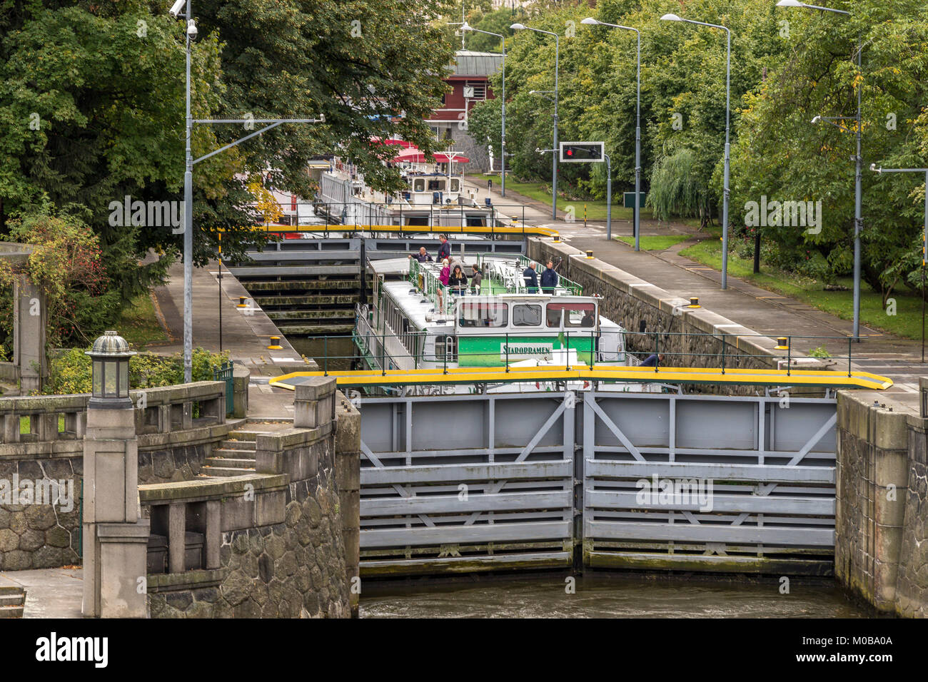 A sightseeing boat waits in the Lock along the River Vlatava ,Prague , Czech Republic Stock Photo